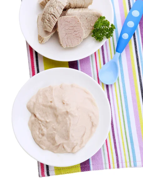 Meat paste for infant feeding, on plate, on color napkin, isolated on white — Stock Photo, Image