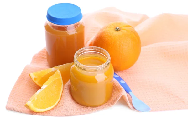 Jars of various baby food with orange, isolated on white — Stock Photo, Image
