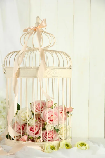 Beautiful decorative cage with beautiful flowers — Stock Photo, Image