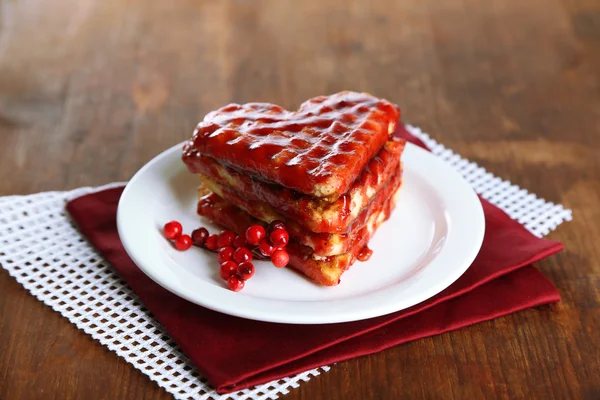 Sweet Belgium waffles with jam, on wooden table background — Stock Photo, Image