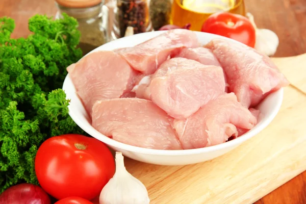 Raw turkey meat on wooden table close up — Stock Photo, Image