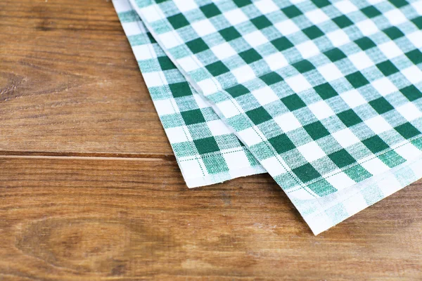 Kitchen towels on wooden background — Stock Photo, Image