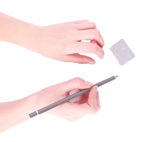 Elleri kalem ve silgi üzerinde beyaz izole — Stok fotoğraf