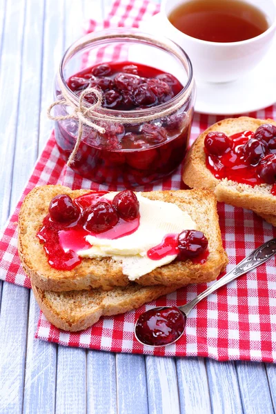 Delicious toast with jam on table close-up — Stock Photo, Image