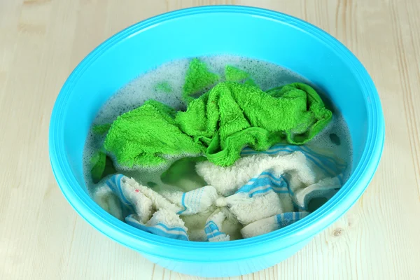 Soaking things in bowl on wooden table — Stock Photo, Image