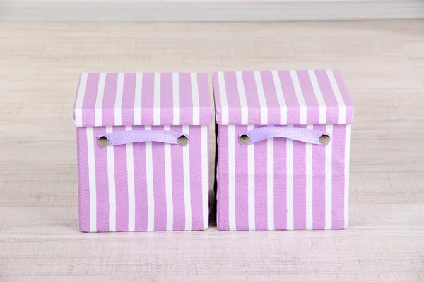 Textile boxes on floor in room — Stock Photo, Image