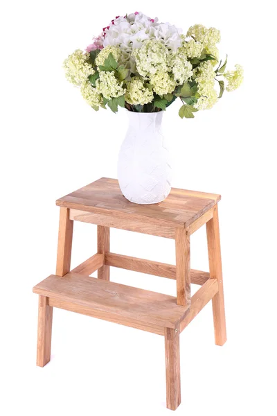 Vase with flowers on small wooden ladder, isolated on white — Stock Photo, Image