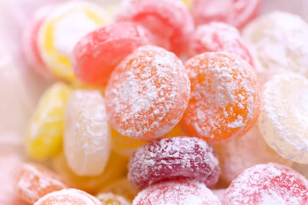 Sweet multicolor candies on paper, close up — Stock Photo, Image