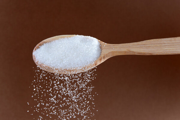 Sugar on brown background
