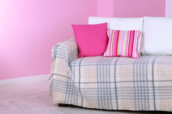 White sofa in room on pink wall background — Stock Photo, Image