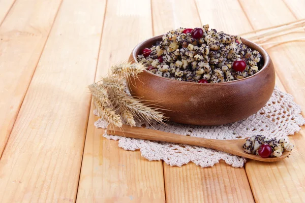 Plate with kutia - traditional Christmas sweet meal in Ukraine, Belarus and Poland, on wooden background — Stock Photo, Image