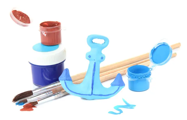 Hand made ceramic anchor and color paints isolated on white — Stock Photo, Image