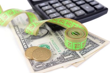 Tape measure with money and calculator close-up clipart