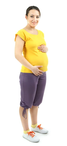 Hermosa joven embarazada tocando su vientre aislado en blanco — Foto de Stock
