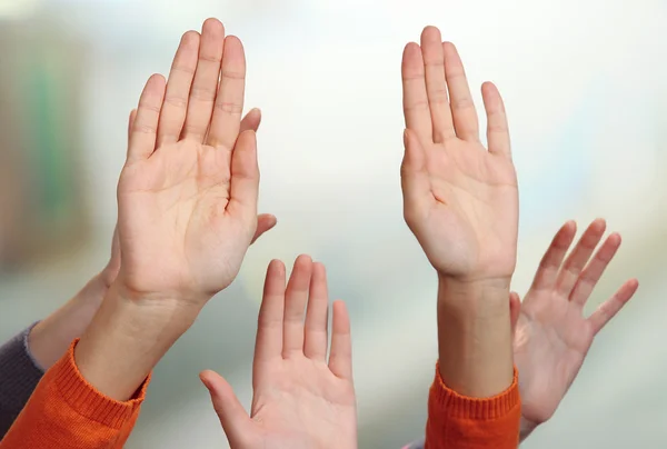 Human hands on bright background — Stock Photo, Image