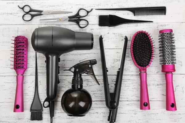 Hairdressing tools on white wooden table close-up — Stock Photo, Image