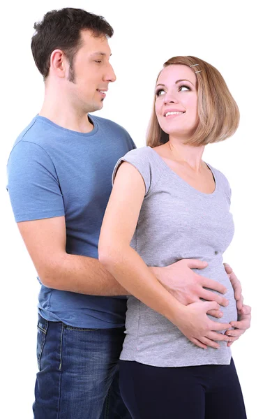 Jonge zwangere vrouw met haar echtgenoot geïsoleerd op wit — Stockfoto