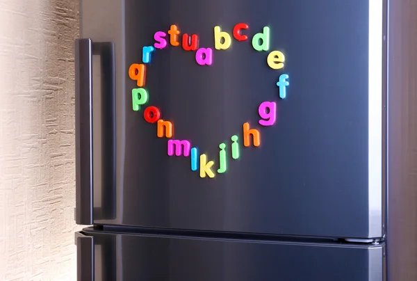 Colorful magnetic letters on refrigerator — Stock Photo, Image