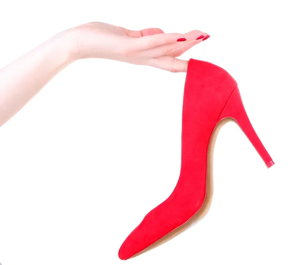 Kadın el üzerinde beyaz izole güzel kırmızı kadın ayakkabı tutarak — Stok fotoğraf