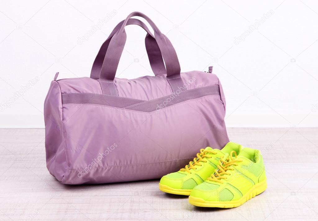 Sports bag with sports equipment in gymnasium