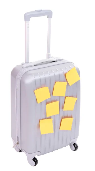 Resväska med papper klistermärken isolerad på vit — Stockfoto