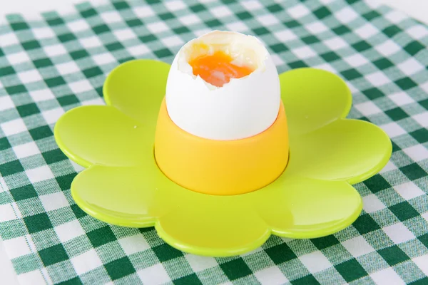 Boiled egg in egg cup on table close-up — Stock Photo, Image
