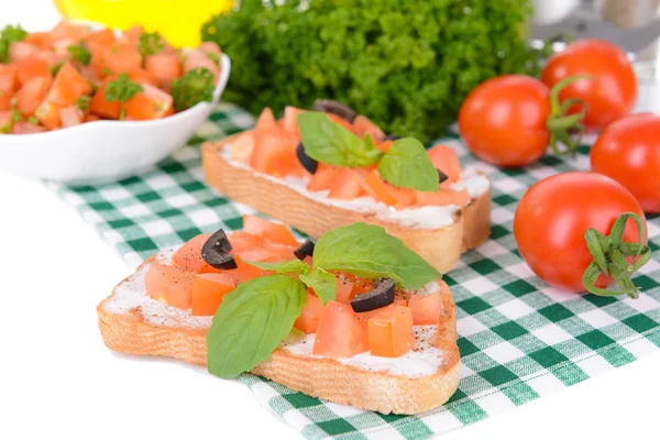 Delicious bruschetta with tomatoes on table close-up — Stock Photo, Image