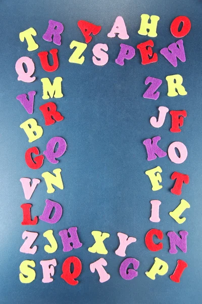 English alphabet on school desk background — Stock Photo, Image
