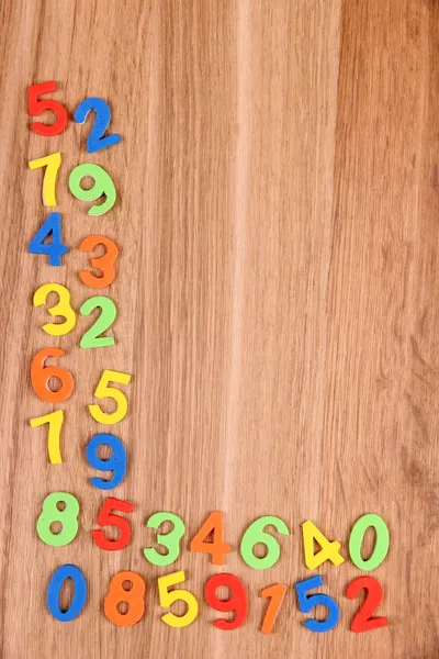 Colorful numbers on wooden background — Stock Photo, Image