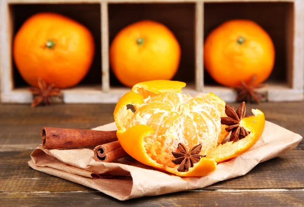 Ripe sweet tangerines in wooden box,on wooden background, close-up — Stock Photo, Image