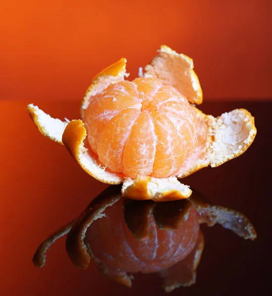 Ripe sweet tangerine, on dark color background — Stock Photo, Image