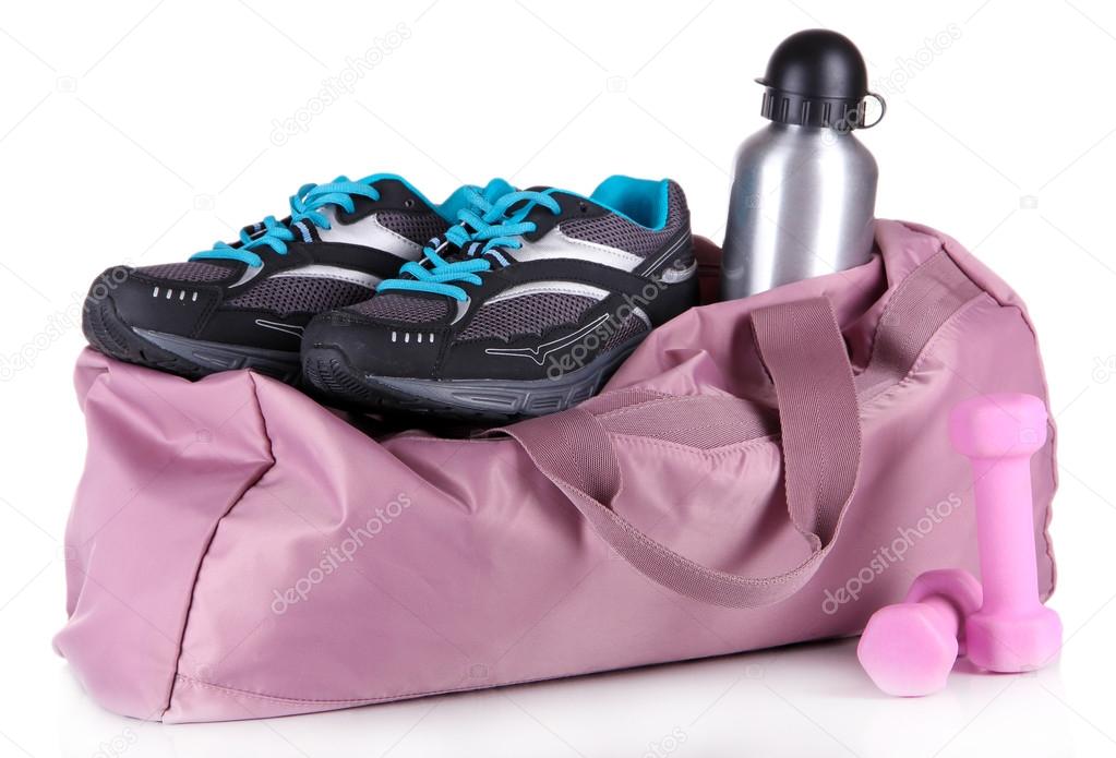 Sports bag with sports equipment isolated on white