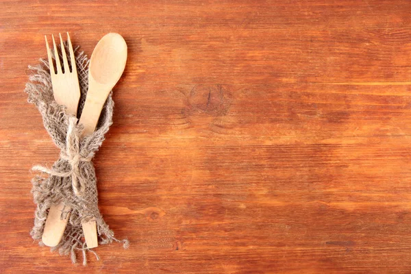 Spoon and fork on wooden table — Stock Photo, Image