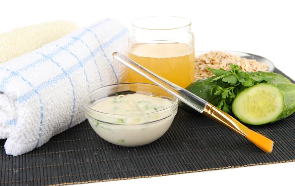 Homemade facial masks with natural ingredients, on bamboo mat, isolated on white — Stock Photo, Image