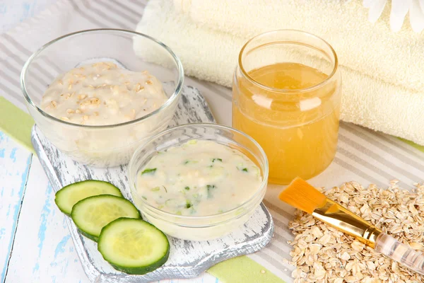 Homemade facial masks with natural ingredients, on color wooden background — Stock Photo, Image