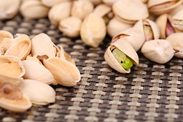 Pistachio nuts on table close up — Stock Photo, Image