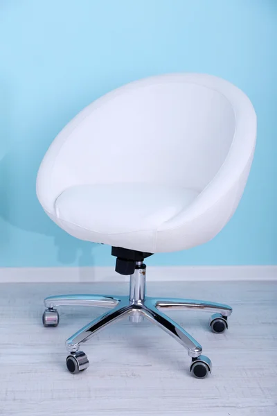 Modern chair in room on blue background — Stock Photo, Image