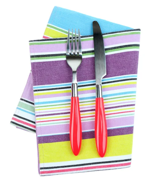 Kitchen cutlery on color napkin isolated on white — Stock Photo, Image