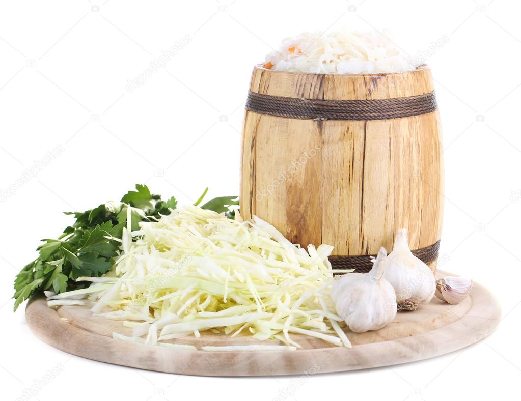 Marinated cabbage (sauerkraut), in wooden barrel, isolated on white