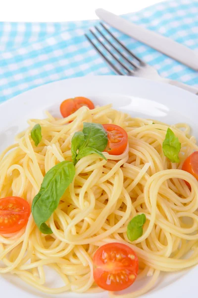 Delicious spaghetti with tomatoes on plate on table close-up — Stock Photo, Image