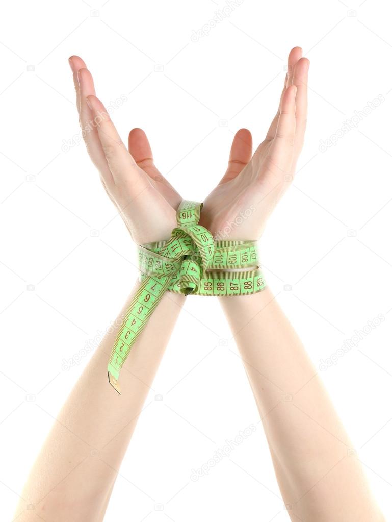 Woman hands with measuring tape isolated on white