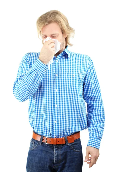 Sneezing young man isolated on white — Stock Photo, Image