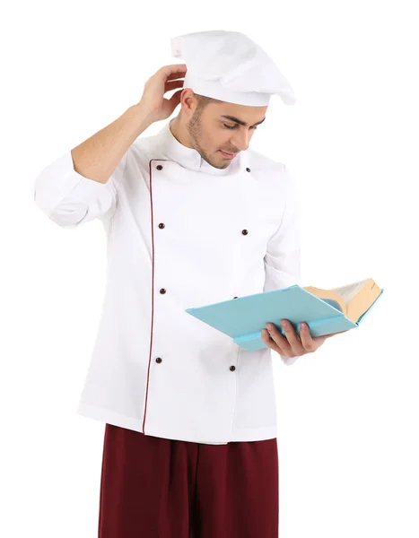 Professionele chef-kok met boek, in witte uniform en hoed, geïsoleerd op wit — Stockfoto