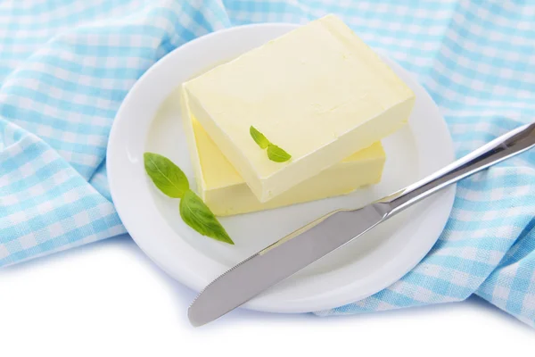 Tasty butter on plate, isolated on white — Stock Photo, Image