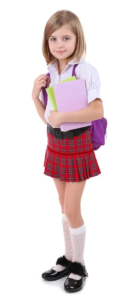 Beautiful little girl with backpack holding books isolated on white — Stock Photo, Image