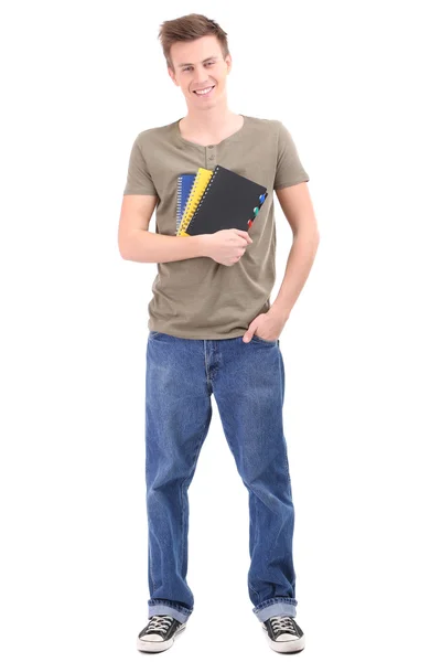 Schöner junger Mann mit Notizbüchern, isoliert auf weiß — Stockfoto