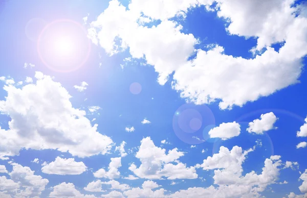 Blue sky with clouds and sun — Stock Photo, Image