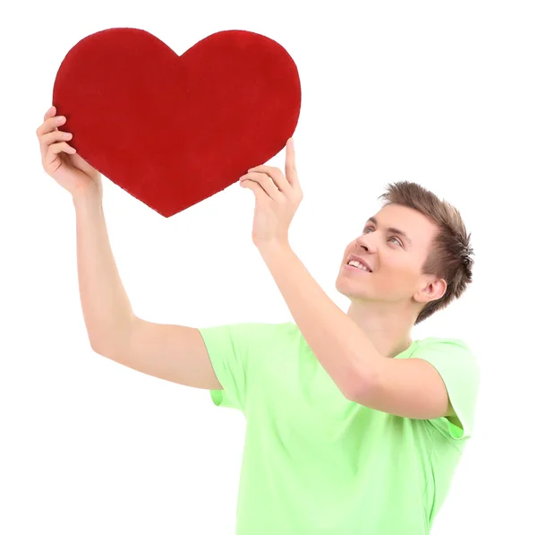 Handsome young man with big red heart, isolated on white Stock Picture