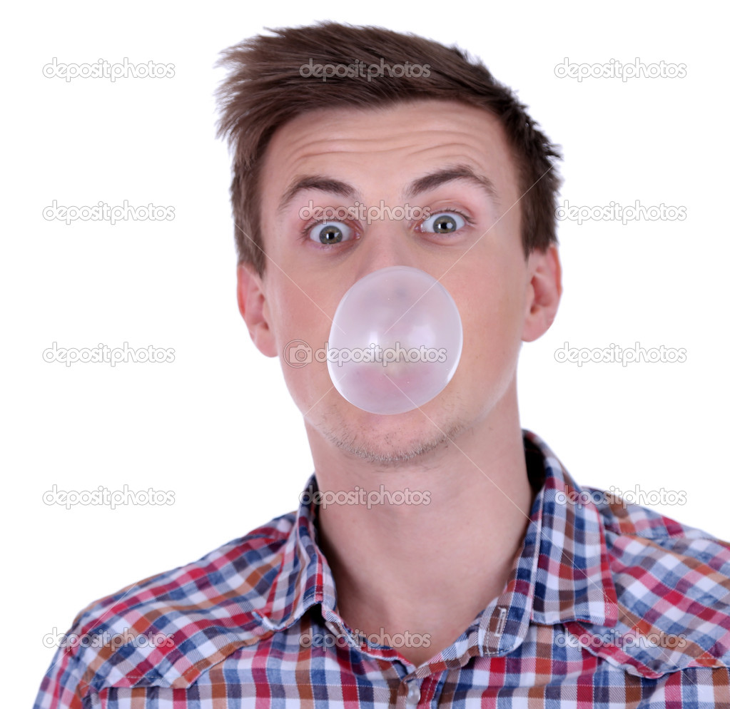 Young man blowing bubble of chewing gum isolated on white