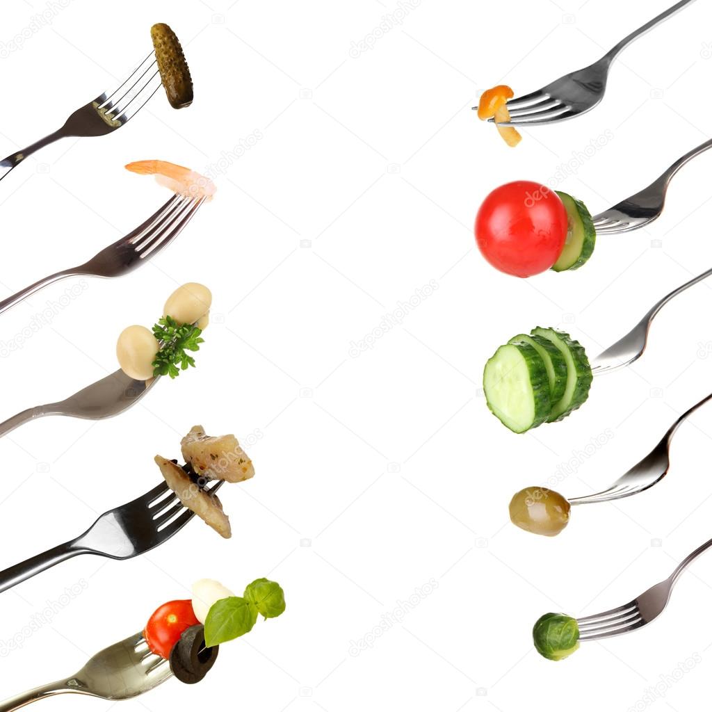 Collage of food on forks isolated on white